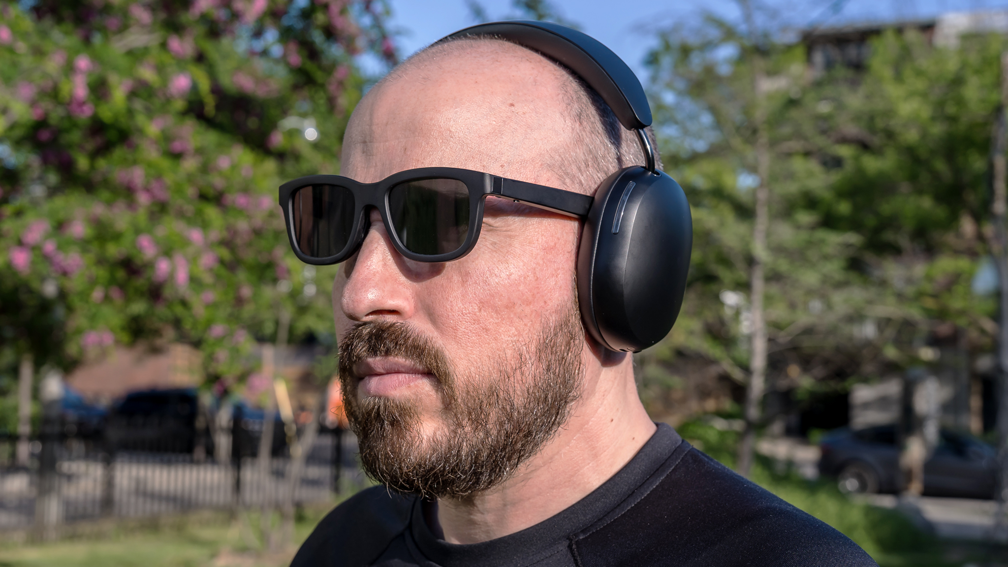 Wearing Sonos Ace headphones outside with sunglasses.