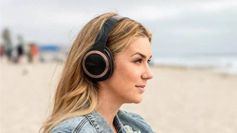 Woman wearing Cleer Audio Enduro ANC.