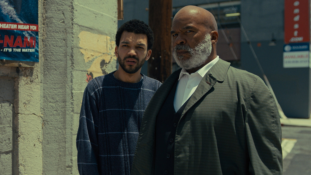 Aren and Roger standing in a street in The American Society of Magical Negroes