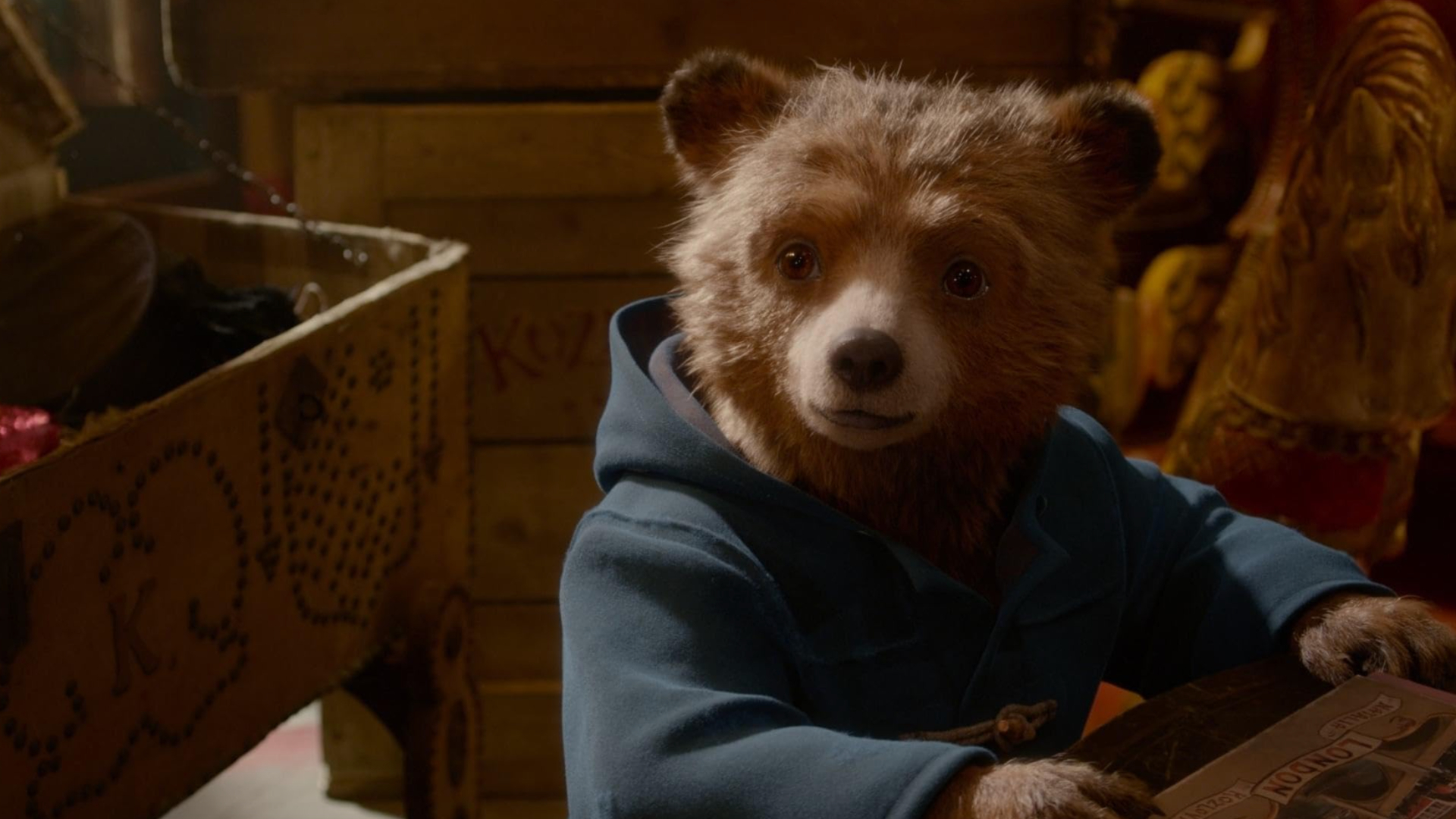 Paddington wearing his blue raincoat but not his hat in Paddington 2