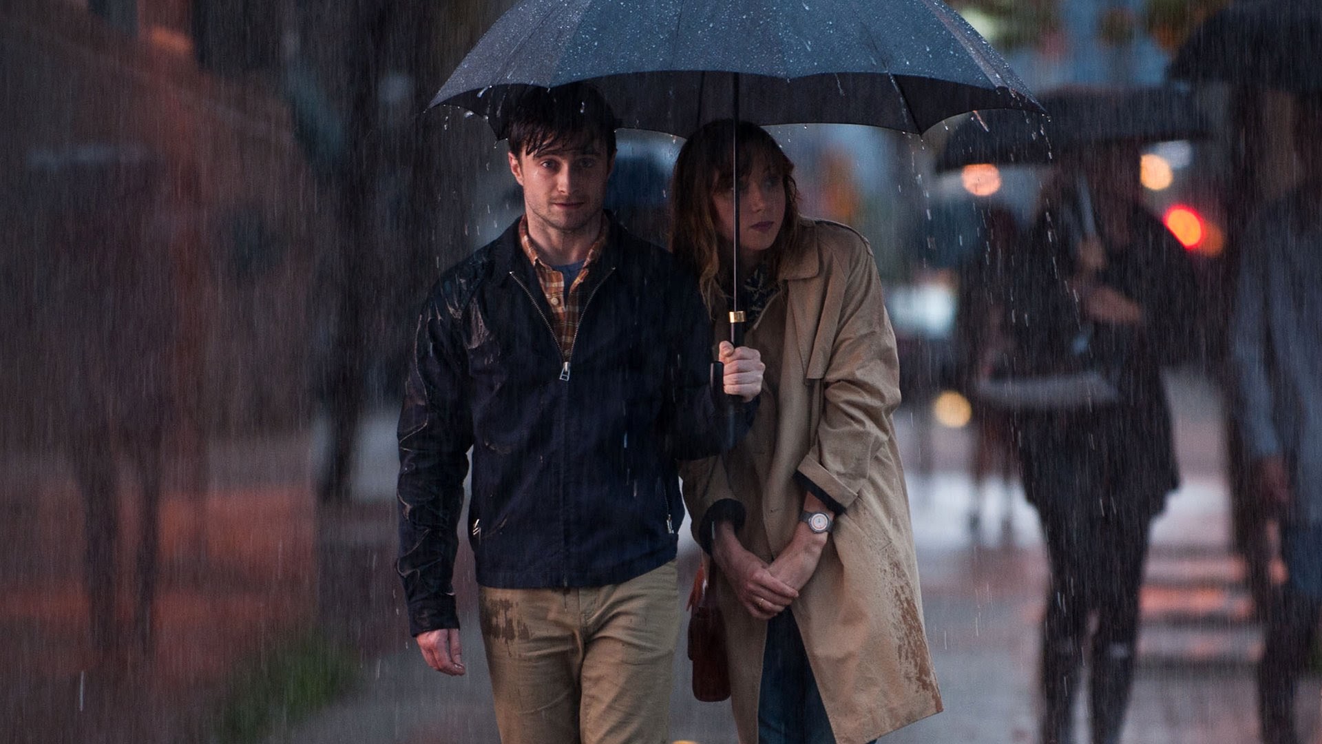 Wallace and Chantry walk under an umbrella in What If