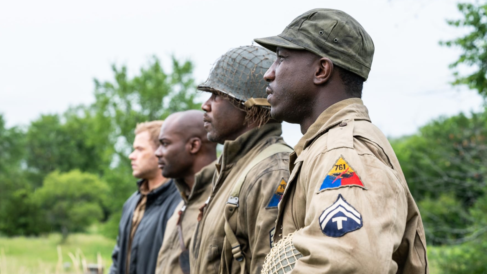 A squad of American Army soldiers stand in line