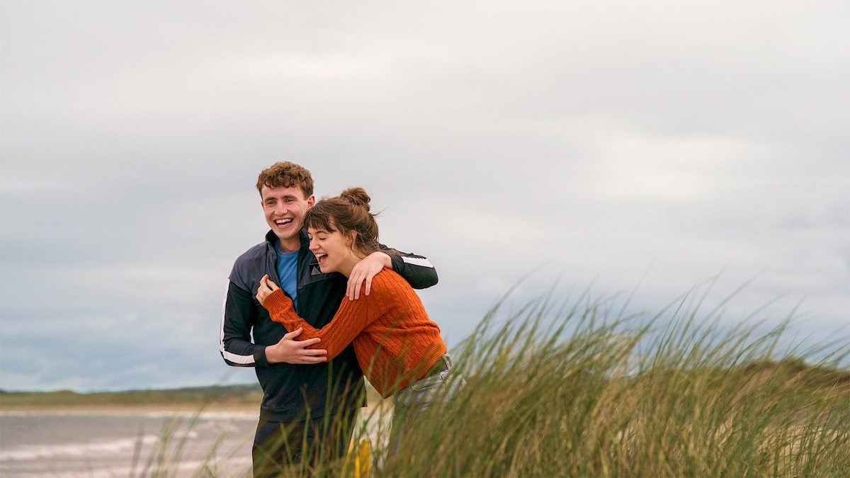 Connell and Marianne joking around on the beach.