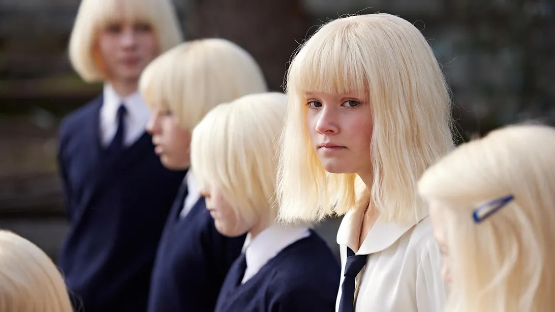 A still from the tv show The Clearing of child characters with very light blonde hair