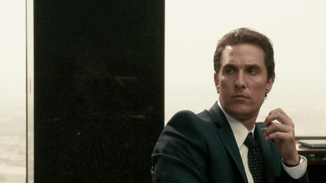 Matthew McConaughey as Mickey Haller looking pensive at something off camera.