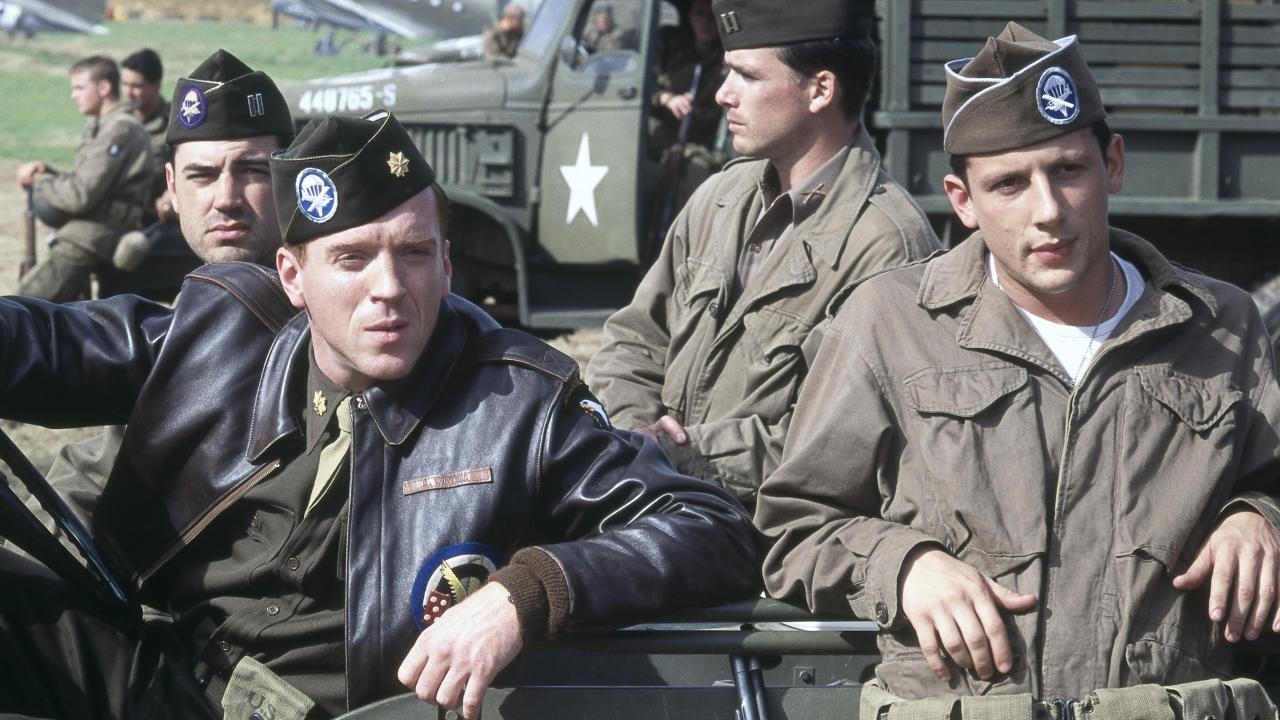 A group of soldiers sitting in a car in Band of Brothers