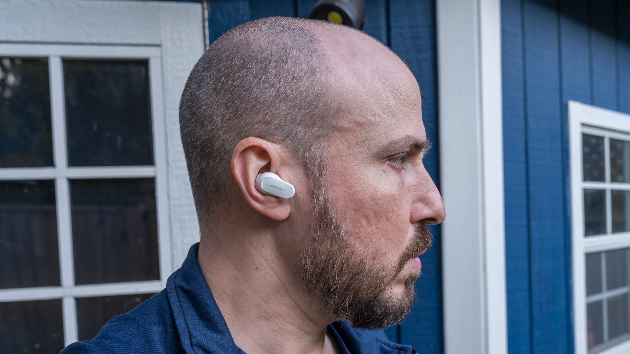 Side view wearing the Bose QuietComfort Ultra Earbuds.