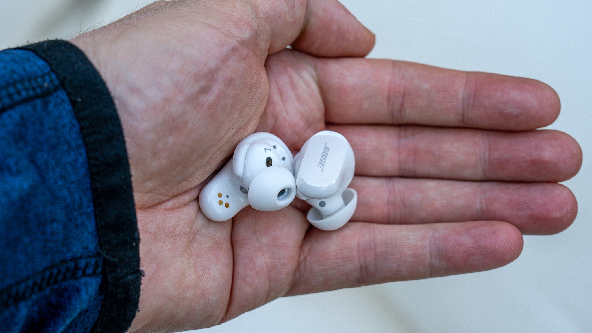 Bose QuietComfort Ultra Earbuds loose in hand.