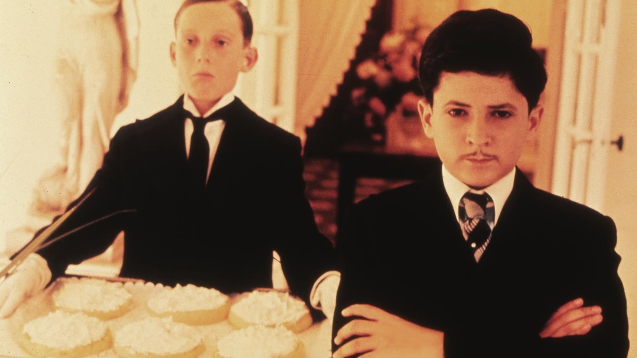 Dandy Dan (Martin Lev) in front of some flans in Bugsy Malone