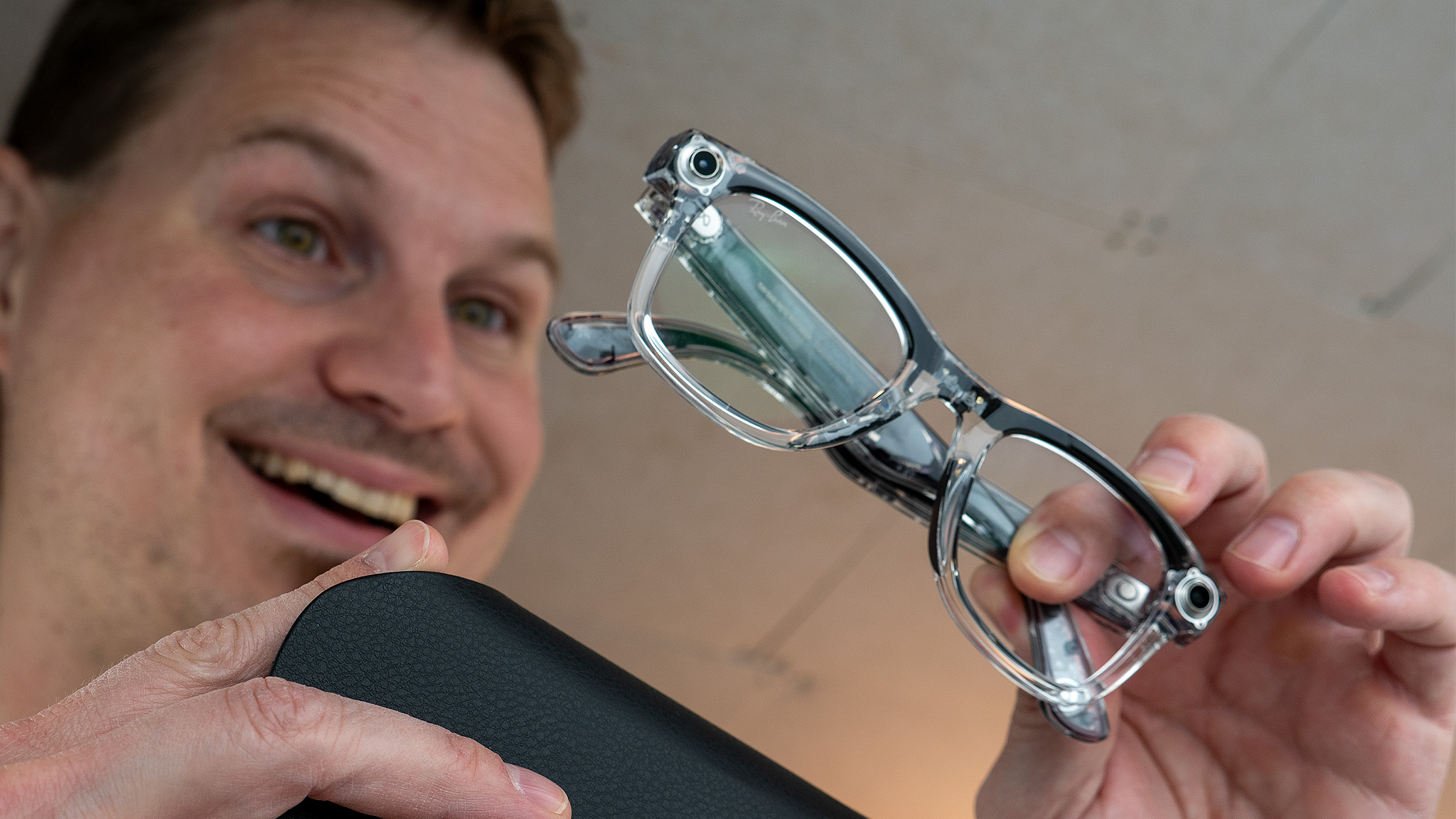 Taking the transparent Ray-Ban Meta Smart Glasses out of its charging case