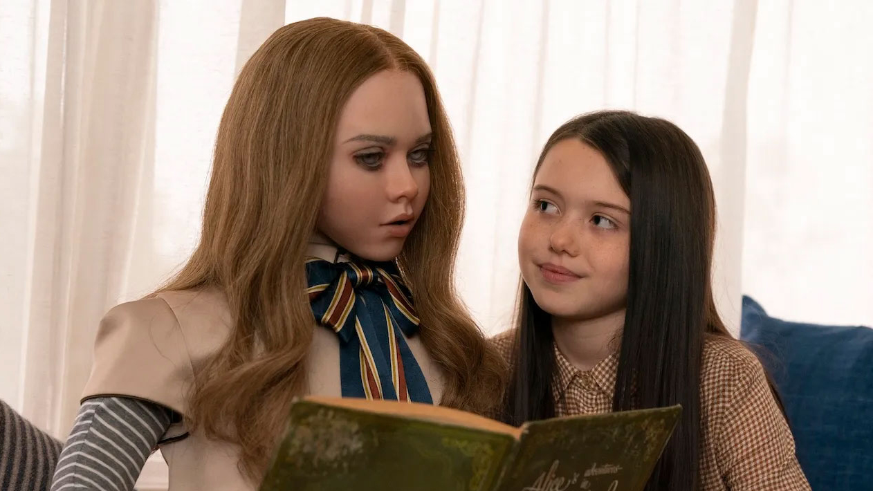 M3GAN and Cady reading a book in the movie M3GAN