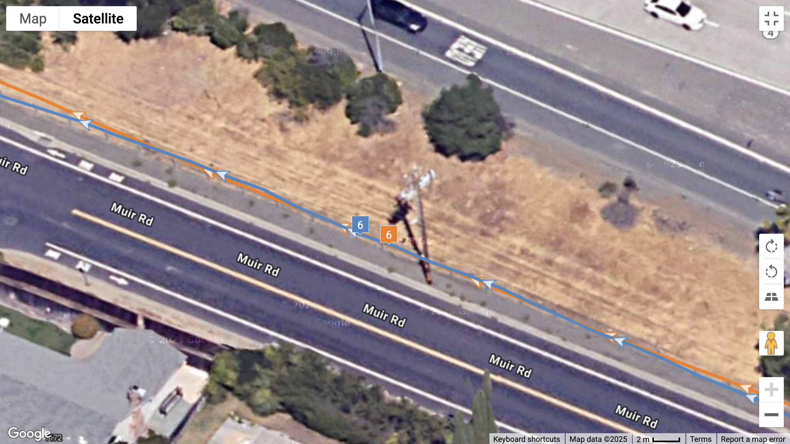 A Google Maps top-down view showing a GPS line for the COROS PACE Pro (orange) and Garmin Fenix 8 (blue)