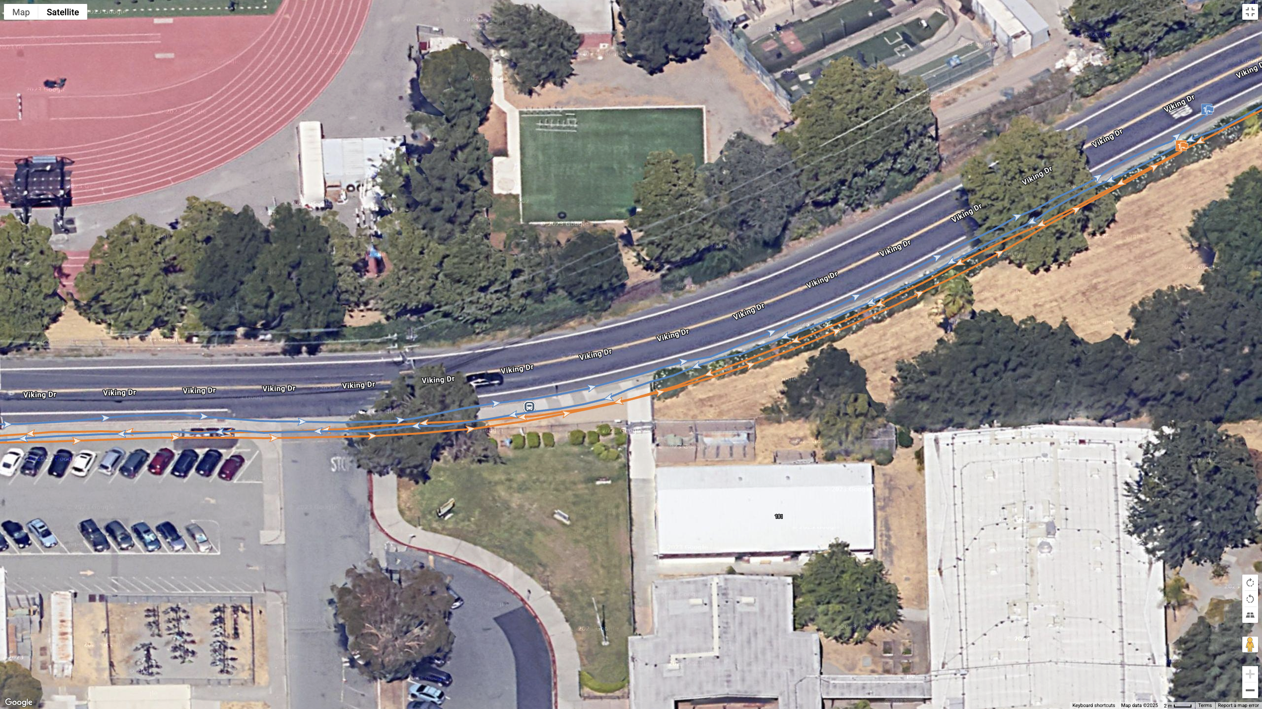 A Google Maps top-down view showing a GPS line for the COROS PACE Pro (orange) and Garmin Fenix 8 (blue)