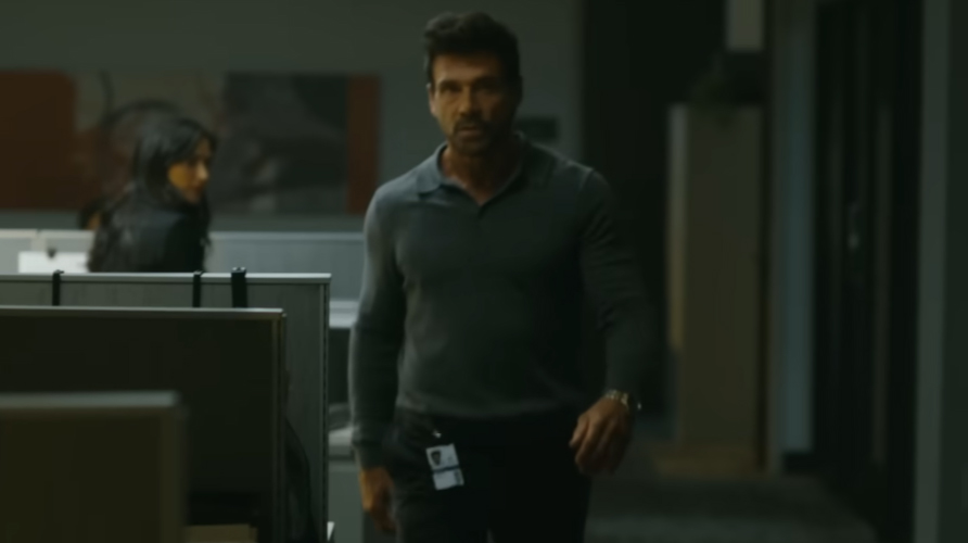 Frank Grillo's Rick Flag Sr walking through an office in Peacemaker season 2