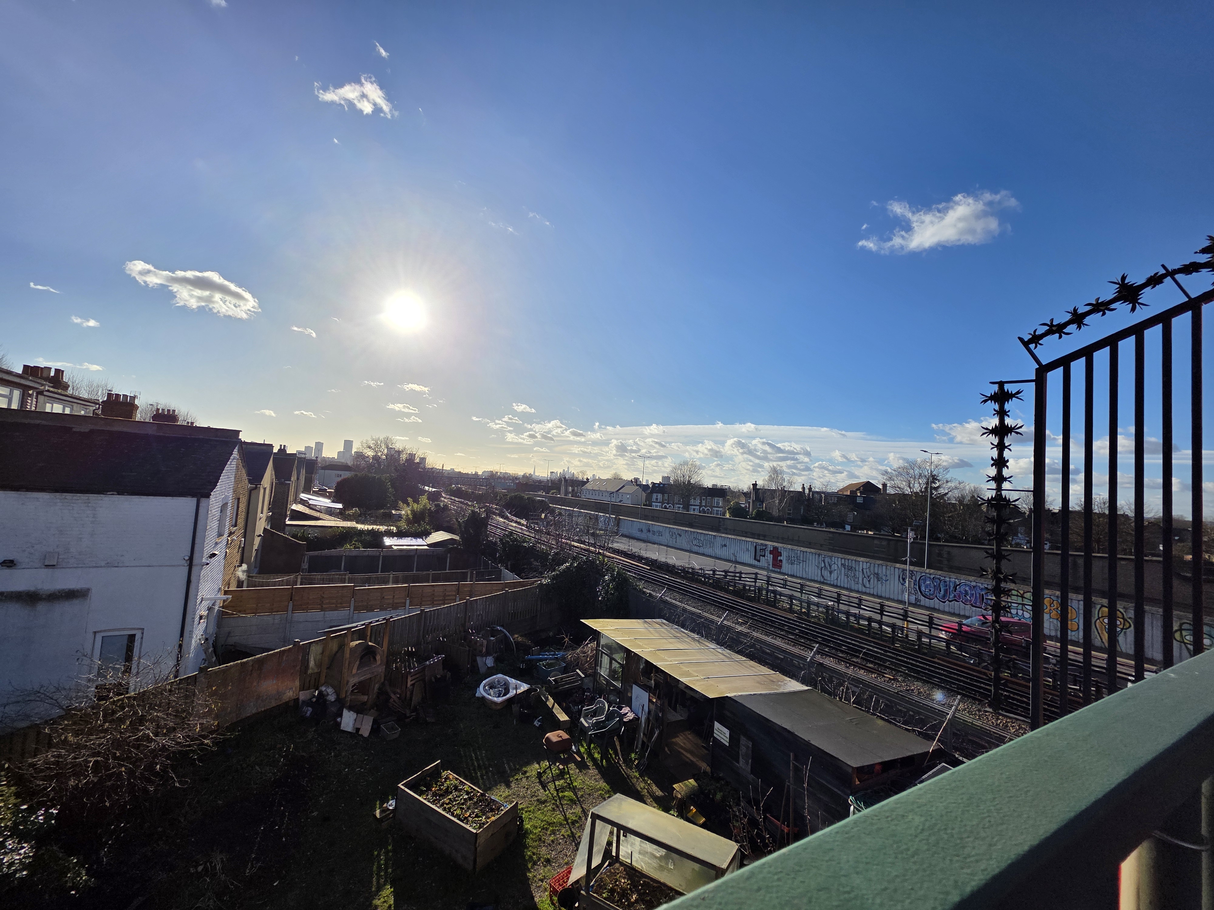 an image of some houses and train tracks shot on the 12MP Galaxy S25 Ultra ultra-wide camera