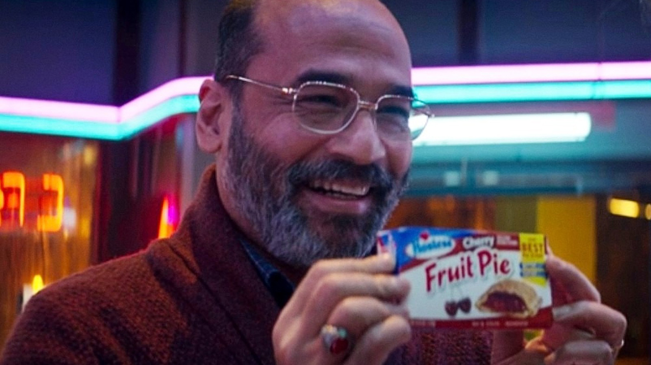 Yusuf Khan holding a Fruit Pie box in Ms. Marvel