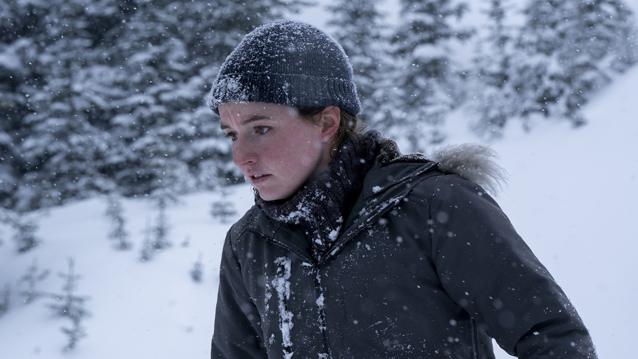 Kaitlyn Dever's Abby walking in a snowy area in The Last of Us season 2