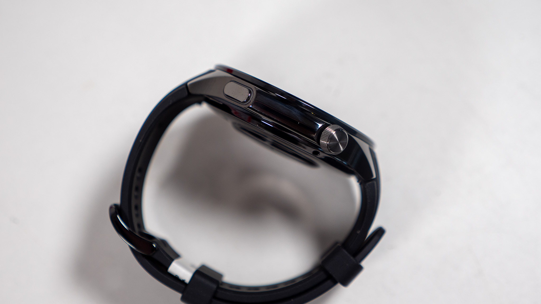 A close-up of the OnePlus Watch 3's buttons and crown