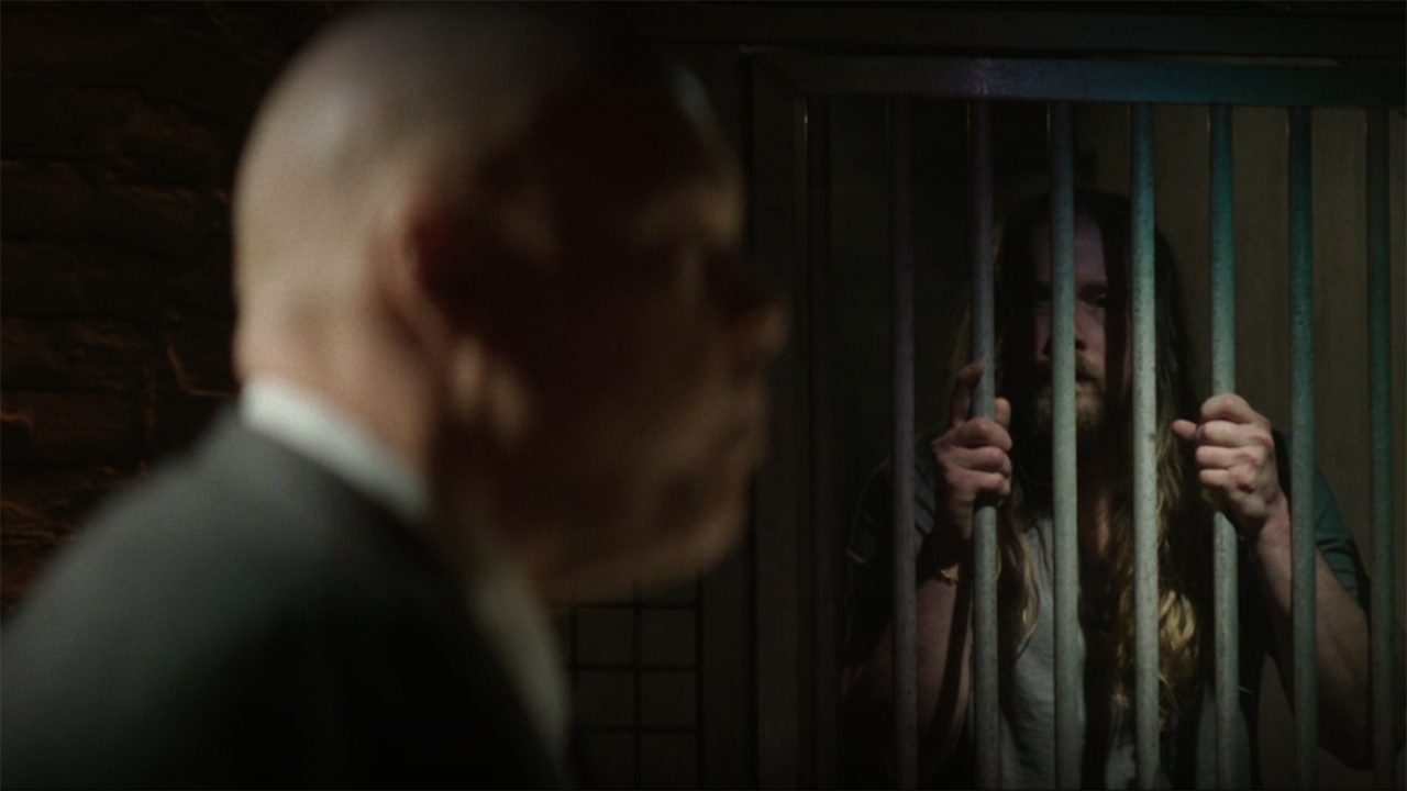 Adam locked up as he watches Wilson Fisk in Daredevil: Born Again episode 4