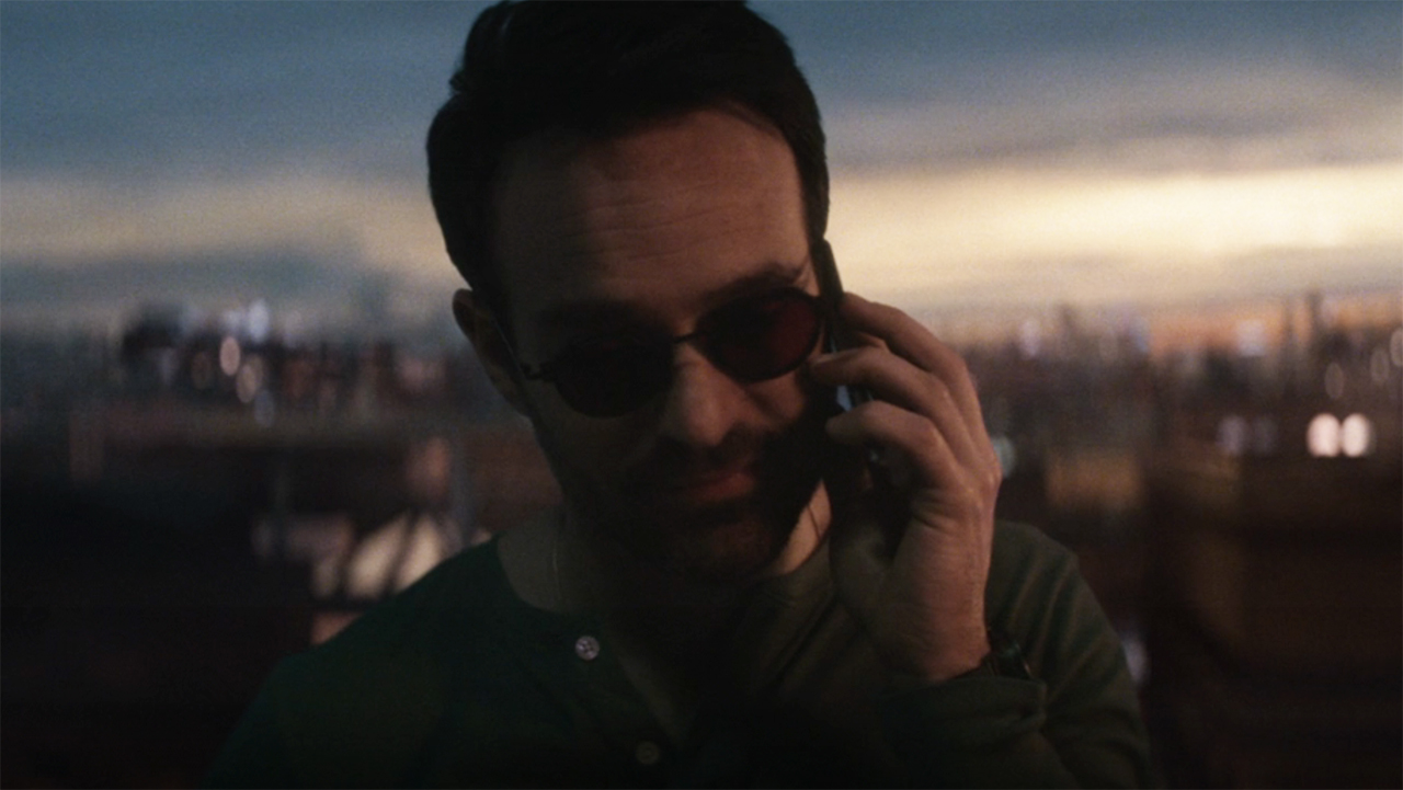 Matt Murdock on the phone while standing on a rooftop in Daredevil: Born Again episode 4