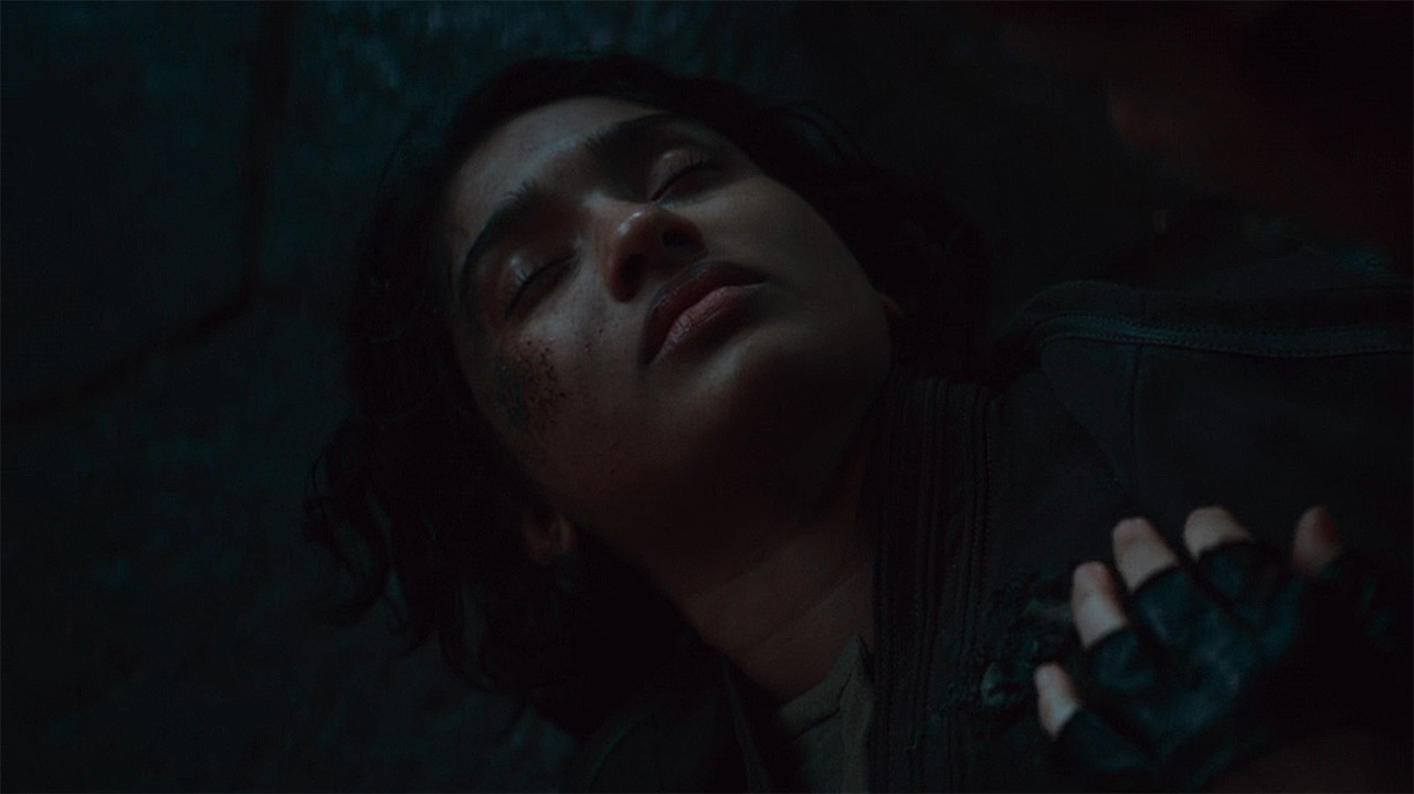 Cinta lying dead on the floor with Vel's left hand on her chest in Andor season 2 episode 6