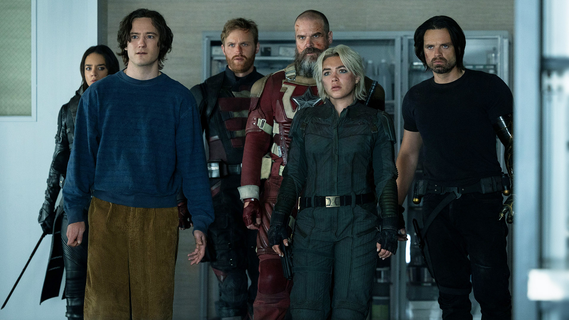 Ghost, Bob, US Agent, Yelena Belova, Red Guardian, and Bucky Barnes standing in a doorway in Marvel's Thunderbolts* movie