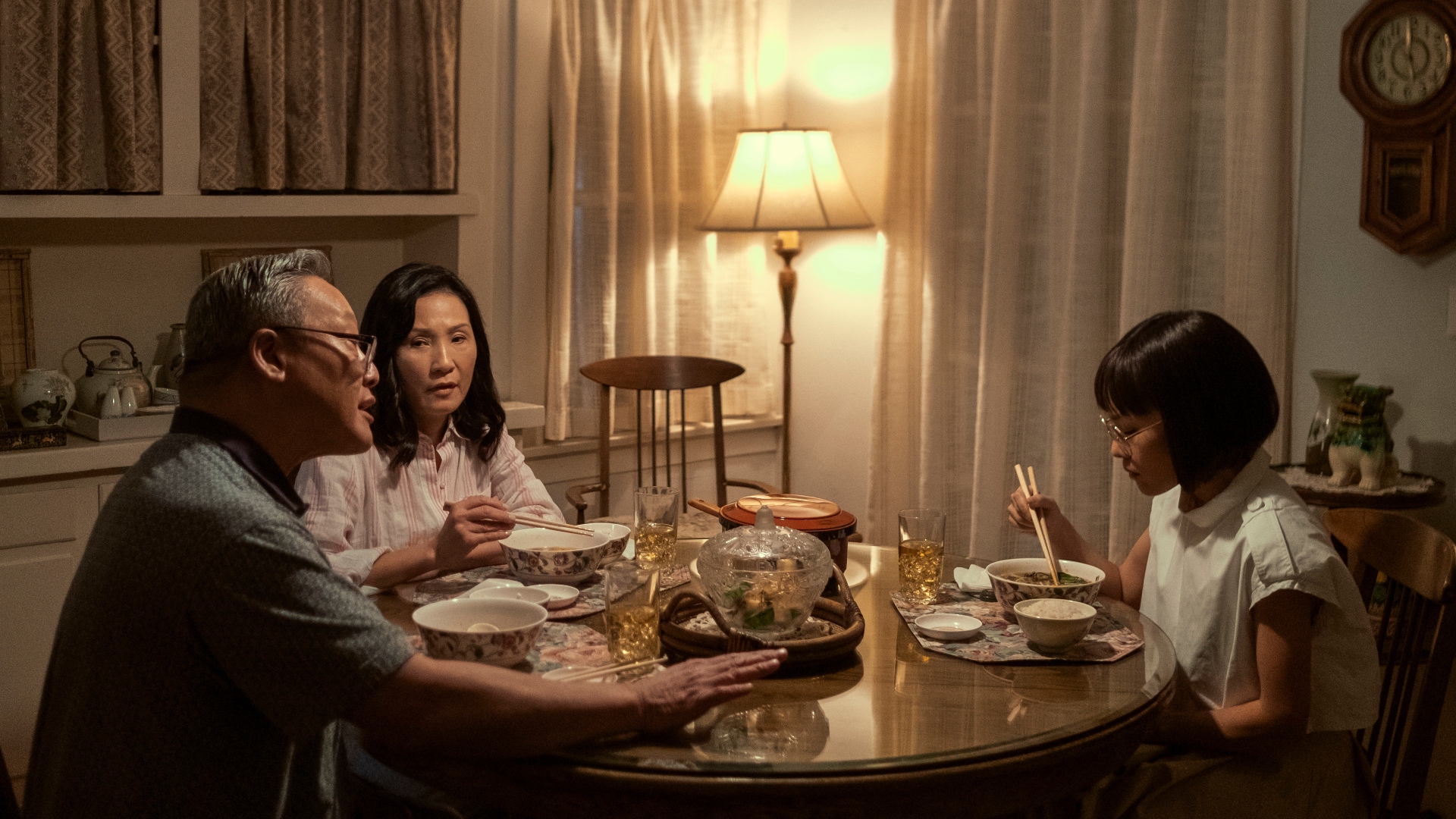 Amy sits with her family at a dinner table in Beef season 1